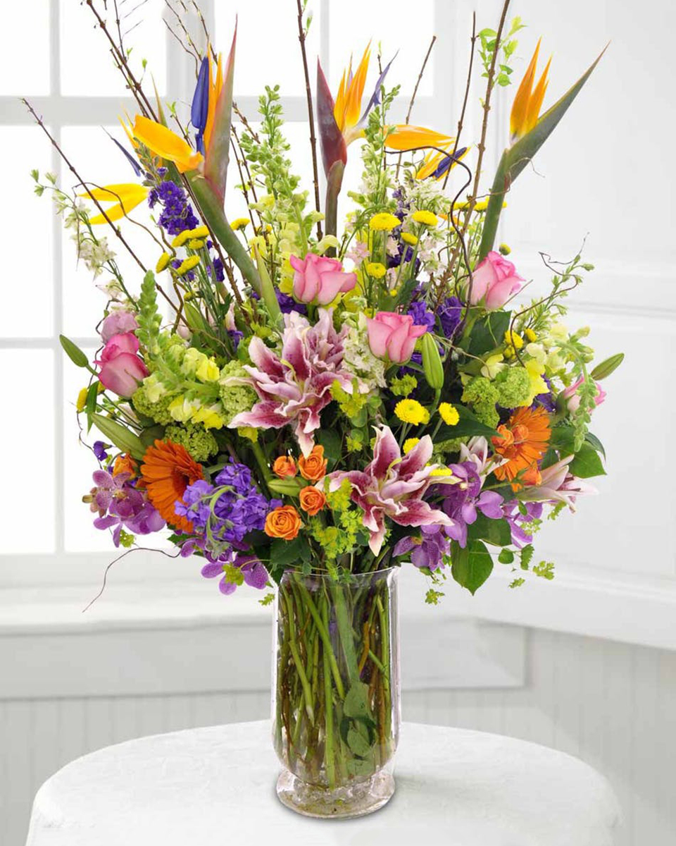 Grand Paradise Standard Birds of Paradise, Snapdragons, Larkspur, Stock, Poms, Stargazer Lillies, Hydrangea, Orchids, Gerbera Daisies, Spray Roses, and Curley Willow make this into a big but stylish arrangement.
DELIVERY: Every order is hand-delivered direct to the recipient. These items will be delivered by us locally, or a qualified retail local florist.