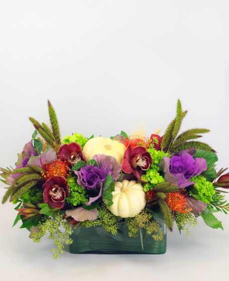 GIVE tHANKS centerpiece-A lush, seasonal collection of orange, purple, burgundy and green blooms - including hydrangea, kale, orchids, and protea - custom arranged in a rectangular glass vase. -fall flowers