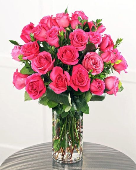PINK FLOYD ROSES-Luscious, vibrant , and unique Pink Floyd Roses are arranged in a vase with seasonal greens and fillers.-ROSES
