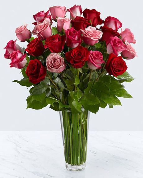 Mixed roses-Gorgeous mixed color roses arranged with in a beautiful tall glass vase.-Mixed rose arrangement