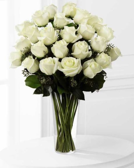 24 White Roses arranged in a Vasr-24 Long Stem White Roses arranged in a Vase with assorted greens and fillers.- White Roses