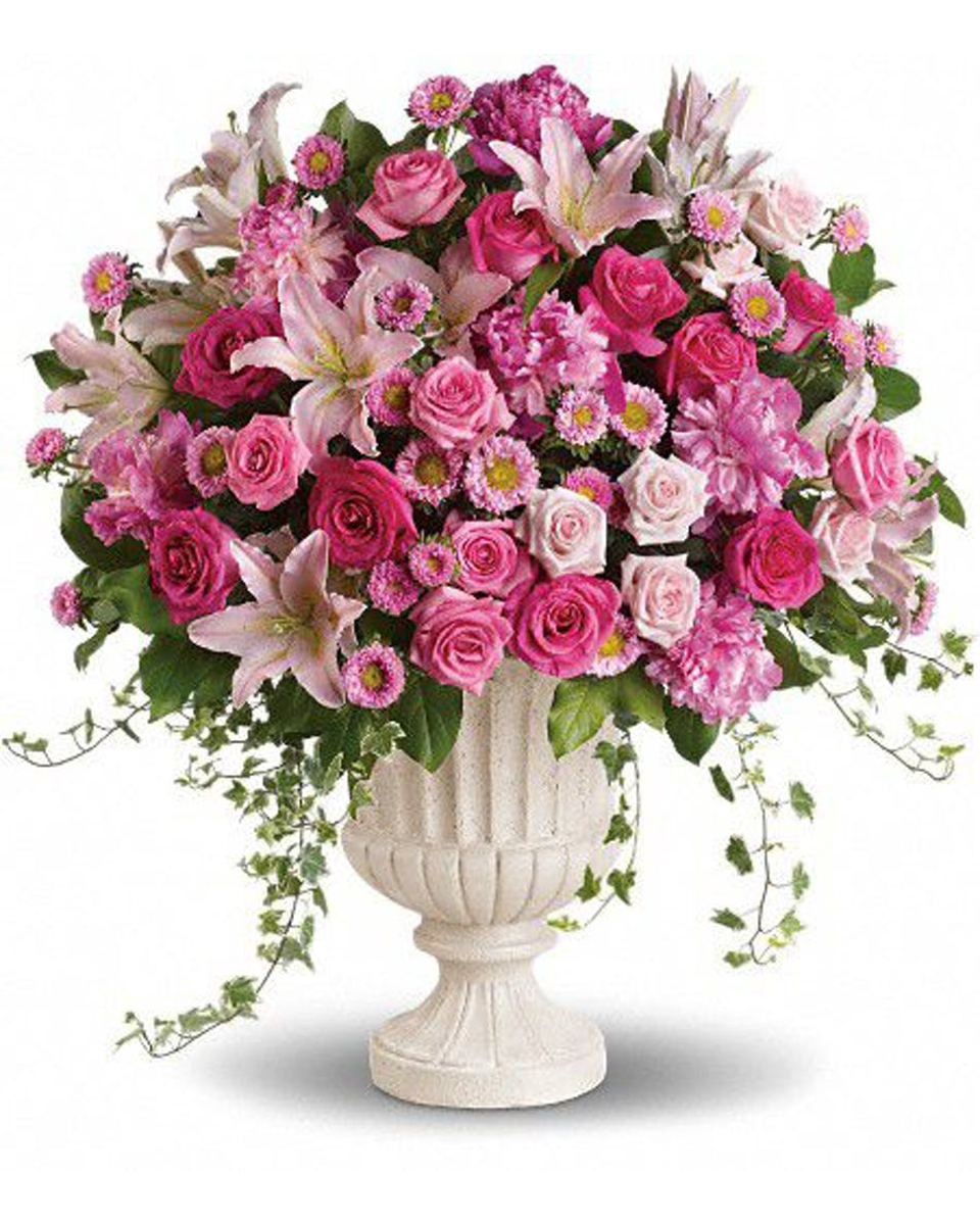 Urning Roses Urning Roses-Standard A big assortment of Lillies, Roses, Peony, Matsomoto Asters and Ivy arranged in a pedestal Urn.
DELIVERY: Every order is hand-delivered direct to the recipient. These items will be delivered by us locally, or a qualified retail local florist.
