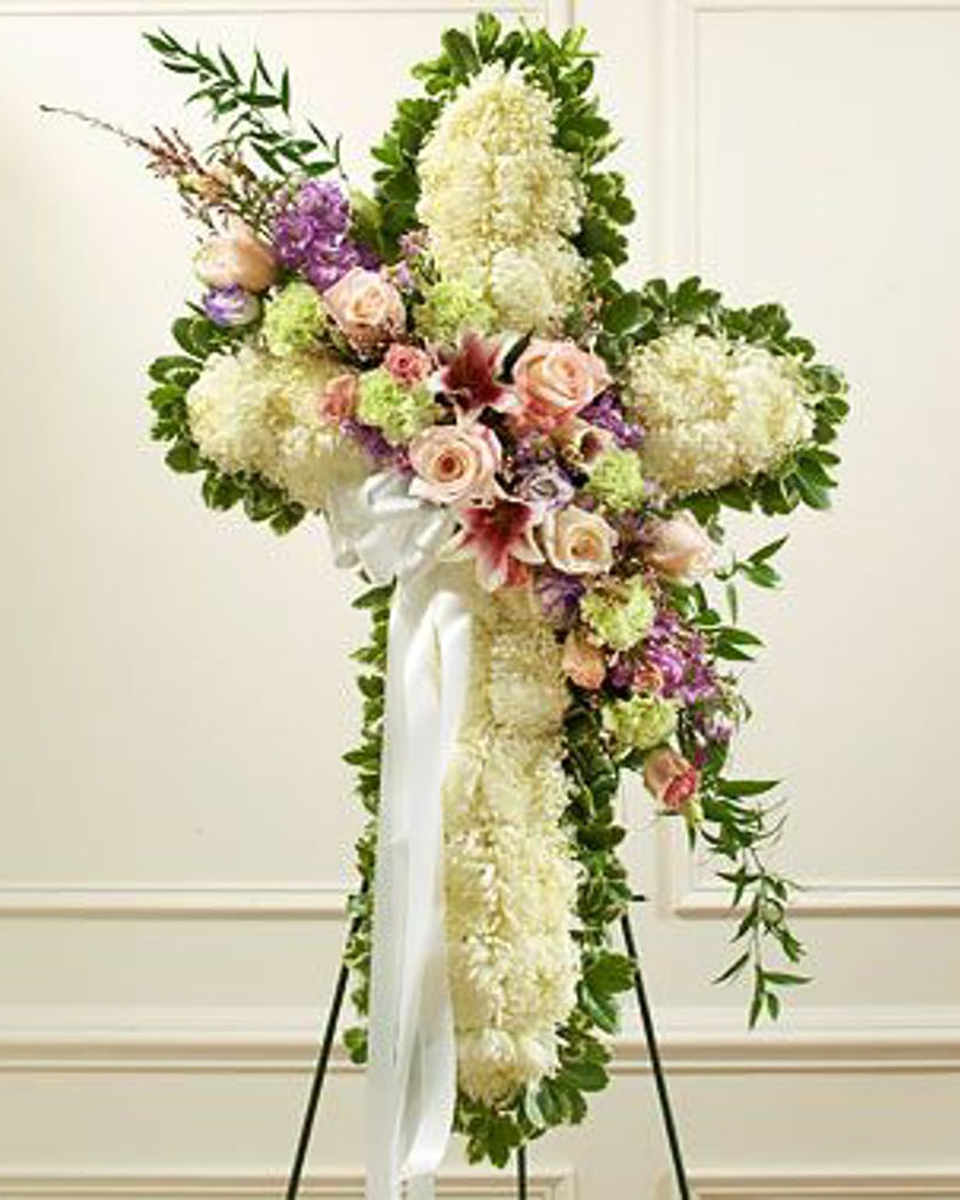 Santa Cruz Standard (24 Inch) A beautiful cross created using white mums and a variety of pastel colored roses, lilies and complementary accent flowers.*Measures approximately 42