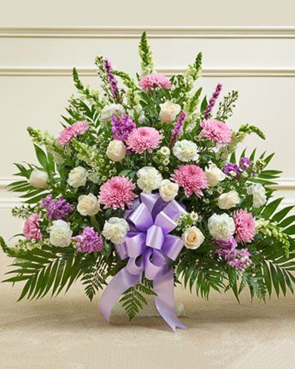Heartfelt Sympathy Basket Premium This arrangement features a variety of the freshest flowers in lavender and white. This arrangement is a lovely expression of your sympathy. Standard arrangement measures approximately 28