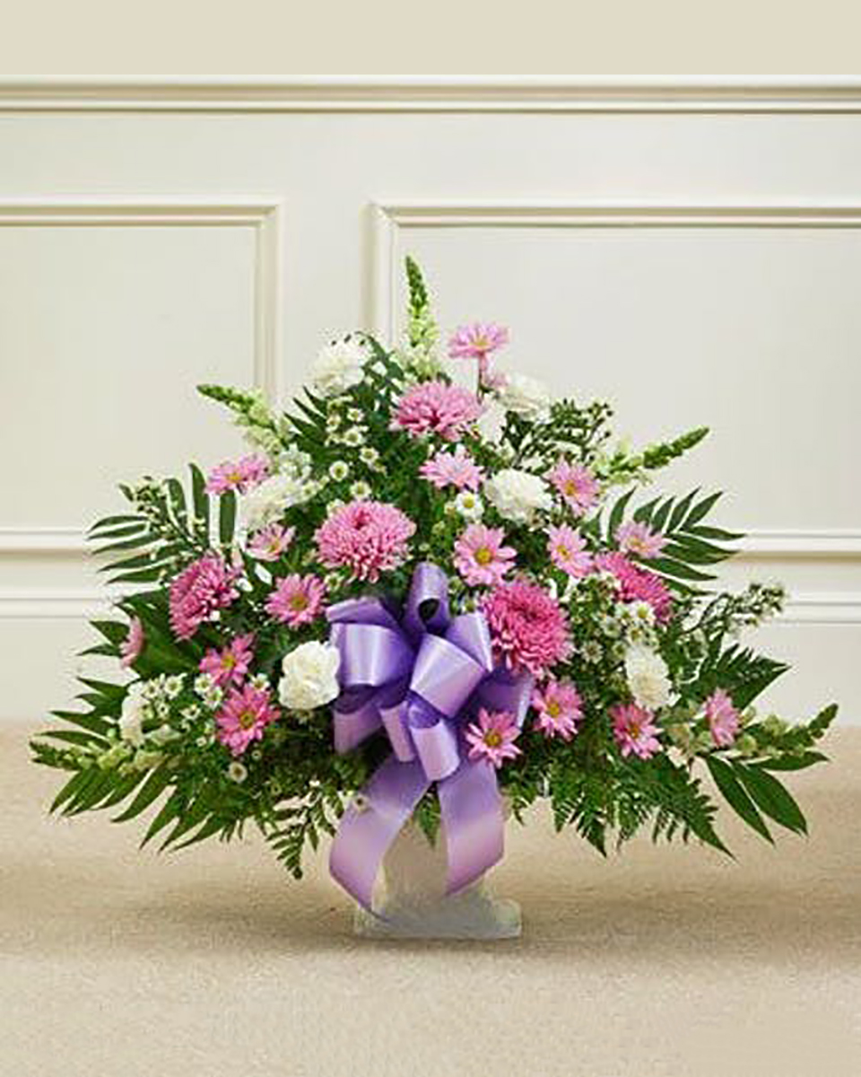 Heartfelt Sympathy Basket standard This arrangement features a variety of the freshest flowers in lavender and white. This arrangement is a lovely expression of your sympathy. Standard arrangement measures approximately 28