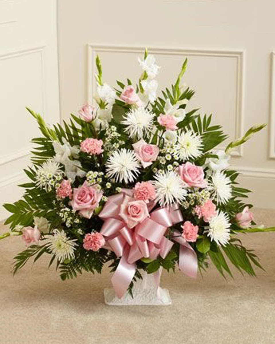 Soft and Elegant Sympathy Basket Standard The ever popular sympathy basket is shown here in a lovely mix of pink and white flowers. Premium measures approximately 32