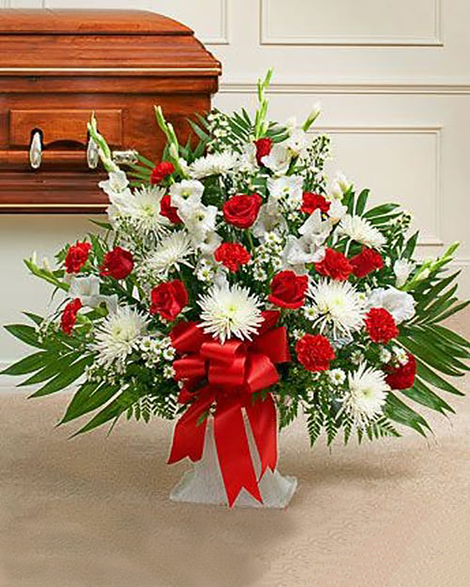 Sincere Sympathy Basket Deluxe Always popular, a sympathy basket is a fitting expression and tribute to a loved one. Red & White basket contains a mix of red roses, mini carnatons, gladiolas and more.Premium arrangement measures approximately 32