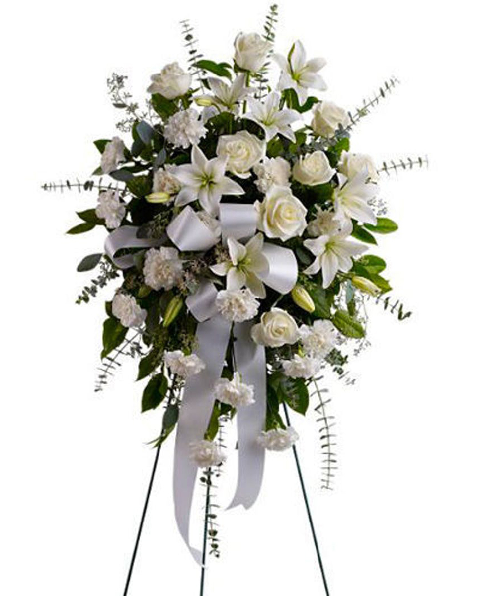 Sentiments of Serenity Standard Channel your inner peace with fresh white blossoms. Send Sentiments of Serenity to express your thoughtfulness and heartfelt condolences. Delivered on an easel, its angelic all-white design reflects purity and virtue.
DELIVERY: Every order is hand-delivered direct to the recipient. These items will be delivered by us locally, or a qualified retail local florist.