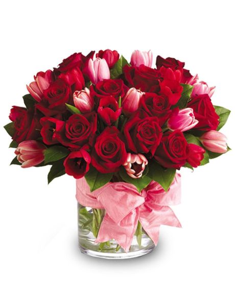 Tulips in Love-Fragrant red roses and delicate tulips accented with a pink bow are two of our most beautiful blooms and the best way to tell someone “I love you”.-tulips