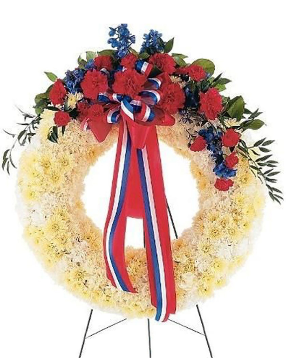 Patriotic Wreath Premium (30 Inch) This wreath with its red, white and blue flowers displays its patriotic spirit to all.Arrangement Details:One solid white wreath arrives on an easel decorated with red carnations and blue delphinium, along with a patriotic red, white and blue ribbon.
DELIVERY: Every order is hand-delivered direct to the recipient. These items will be delivered by us locally, or a qualified retail local florist.