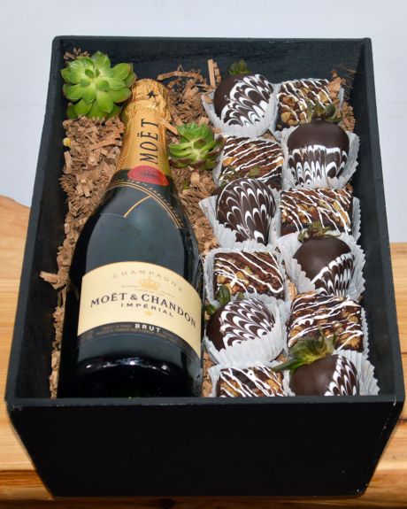 Champagne, wine, and Strawberries-Fresh, Mouth watering chocolate brownies and irrisistable chocolate covered strawberries are paired with Wine or Champagne of your choice and crafted inside a gift wooden box. The brownies and chocolate covered strawberri