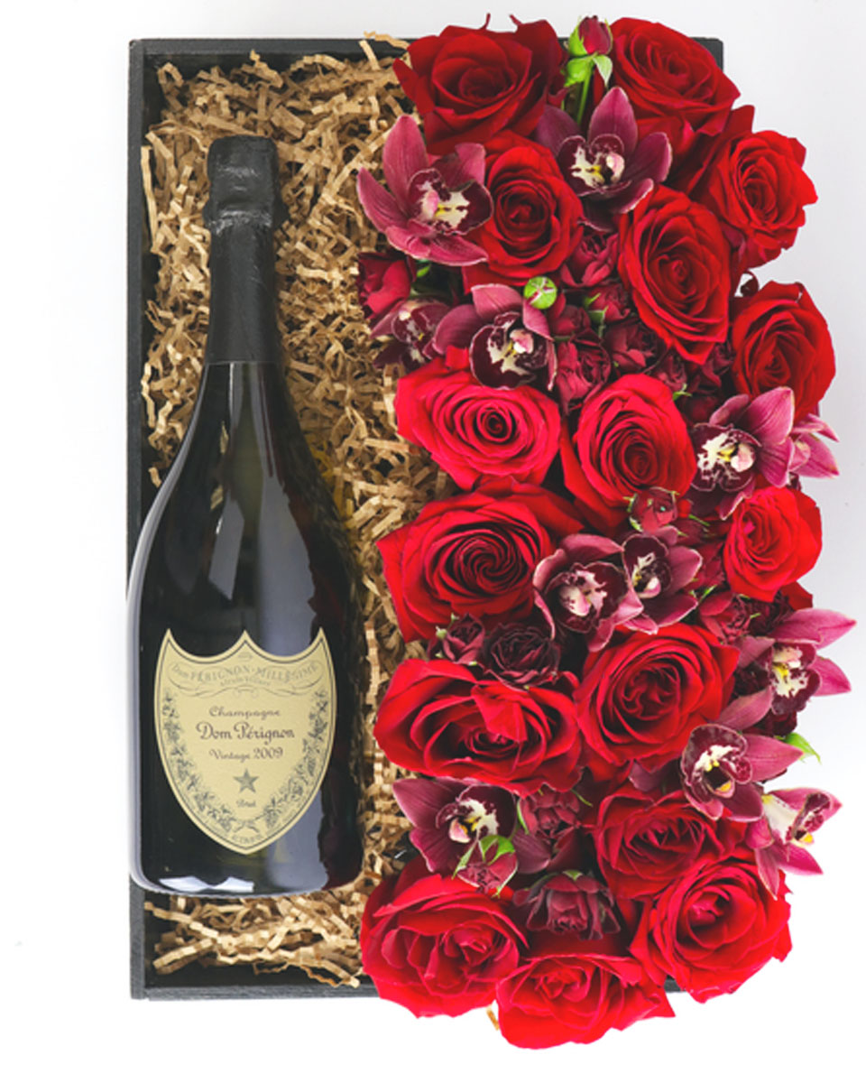 Champagne, Roses, and Orchids Justin Cabernet Sauvignon The elegant combination of Champagne and flowers makes a classic seasonal gift.  Your choice of Dom Pérignon or Justin Cabarnet Sauvignon is matched with a stunning fresh floral arrangement of majestic red roses and cymbidium orchids arranged in a rectangular vase. 
DELIVERY: Every order is hand-delivered direct to the recipient. This item is only deliverable to local areas serviced by Allen’s Flower Market Stores. 
