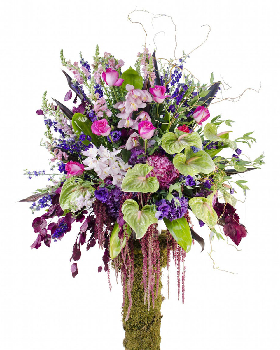 Fountainbleau Fountainbleau-Standard A radiant, multicolored basket using the finest garden flowers is a tribute to the spirit of those passed.  Arrangement includes roses, orchids, calla lilies hydrangea and other assorted garden flowers in shades of Purple, pink and green.
DELIVERY: Every order is hand-delivered direct to the recipient. These items will be delivered by us locally, or a qualified retail local florist.