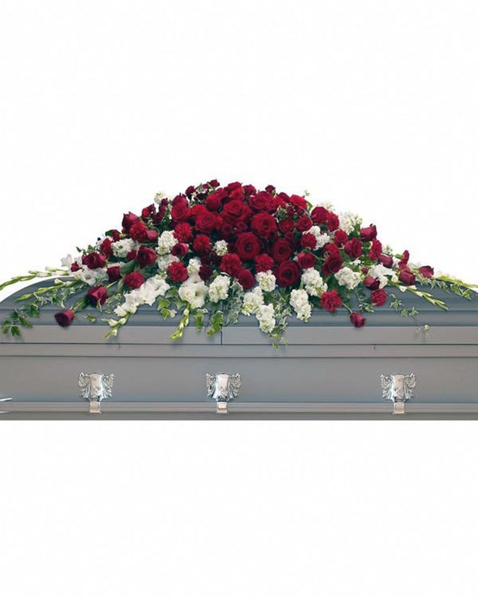Garden of Love Casket Spray Standard Red roses, spray roses and carnations along with graceful white gladioli and stock are arranged beautifully with ivy and salal. 
DELIVERY: Every order is hand-delivered direct to the recipient. These items will be delivered by us locally, or a qualified retail local florist.
