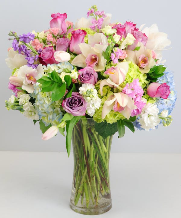 Garden Beauty Standard Send an abundance of love with this stunning work of art comprised of premium floral varieties, including Hydrangea, Roses, Spray Roses, Orchids, Lavender and more! * Flowers & colors may vary slightly.
DELIVERY: Every order is hand-delivered direct to the recipient. These items will be delivered by us locally, or a qualified, retail, local florist.
