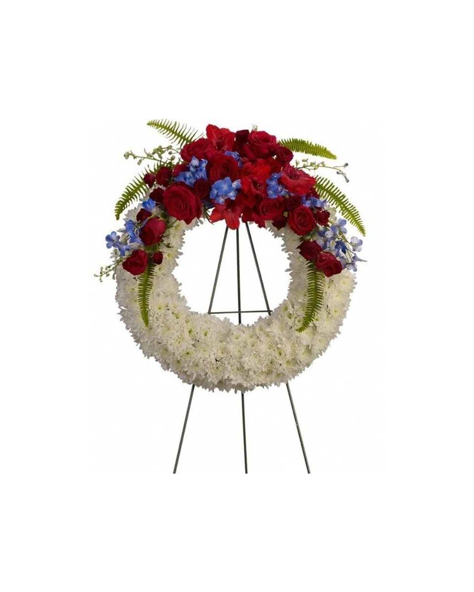 Patriotic Wreath Standard (18 Inch) This wreath with its red, white and blue flowers displays its patriotic spirit to all.Arrangement Details:One solid white wreath arrives on an easel decorated with red carnations and blue delphinium, along with a patriotic red, white and blue ribbon.
DELIVERY: Every order is hand-delivered direct to the recipient. These items will be delivered by us locally, or a qualified retail local florist.