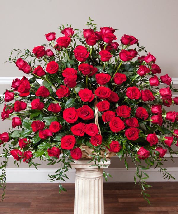 Red Rose Fireside Basket -Premium (96 Roses) A very popular sympathy arrangment, this basket features 24 gorgeous red roses, eucalyptus & greenery. Measures approximately 28” H x 30” W.
DELIVERY: Every order is hand-delivered direct to the recipient. These items will be delivered by us locally, or a qualified retail local florist.