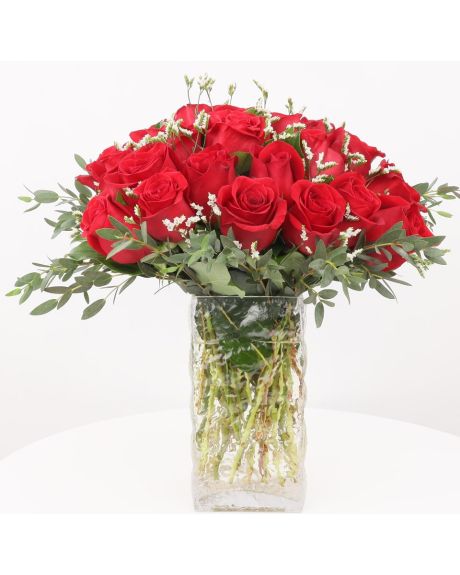 rose cluster-a generous grouping of roses is arranged with very little green in a square cube-roses