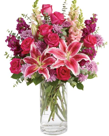 Scent of Spring - Bold and Beautiful, this stunning arrangement features pink roses, stargazer lilies, purple stock and more.-ARRANGEMENT