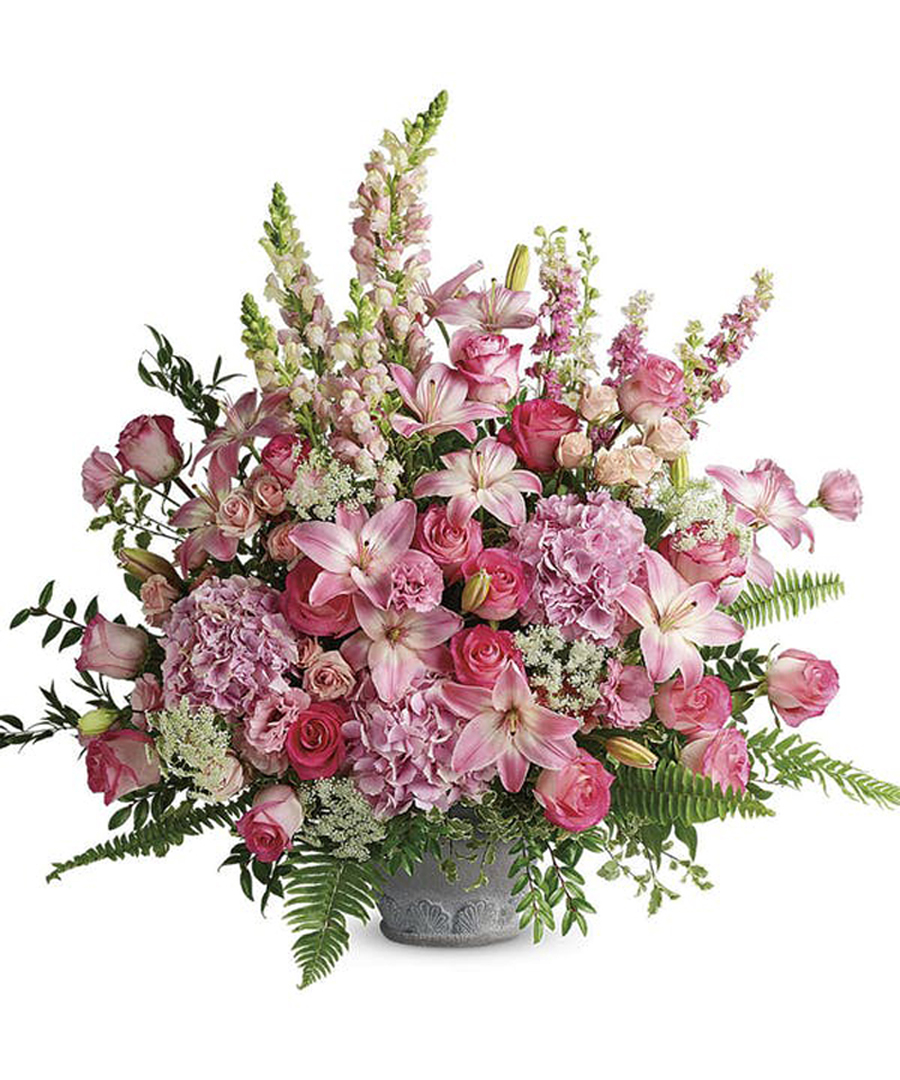 Soft Blush Tribute Premium The soft blush tribute features premium roses, lilies, hydrangea and more.