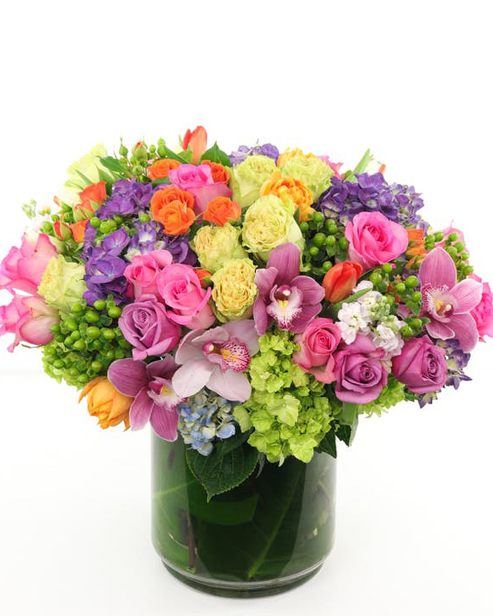 Spring Extravaganza Standard This jaw-dropping arrangement is filled to the brim with bright Spring flowers including multiple varieties of hydrangea, multiple varieties of long stem roses and garden roses, spray roses, tulips, and more!
Presented in a 8 x 8 glass cylinderEntire arrangement is about 18