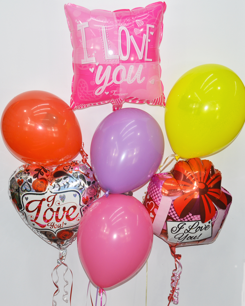 Love Balloon Bouquet Standard Assorted mylar and latex balloons are arranged into a balloon bouquet attached to a gift bag weight.