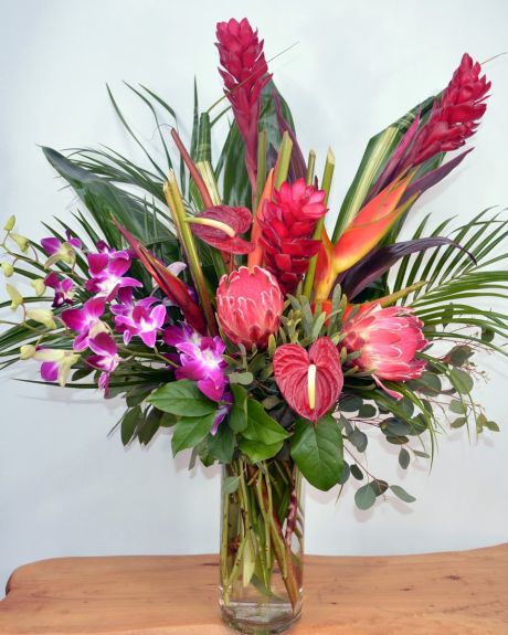 trade Winds-An exotic paradise of tropical flowers and foliage are elegantly arranged in a vase.-Tropical Arrangement