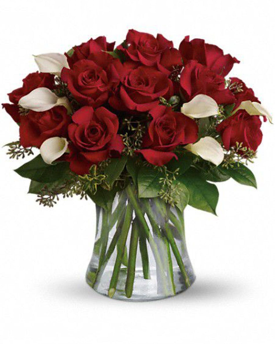 Roses and Callas Standard The floral design team at Allen's Flower Market out did themselves with this stunning design. We start with gorgeous, fresh Ecuadorian red roses, then blend in stunning white callas. All these beautiful blooms are then placed into a stylish glass vase. This one is guaranteed to deliver a smile! 
DELIVERY: Every order is hand-delivered direct to the recipient. These items will be delivered by us locally, or a qualified retail local florist.