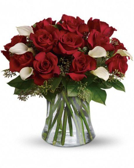 Roses and Callas- We start with gorgeous, fresh Ecuadorian red roses, then blend in stunning white callas. All these beautiful blooms are then placed into a stylish glass vase. - Roses