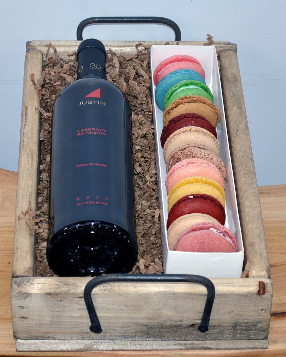 Wine and French Macaroons Justin Cabernet Sauvignon  Sumptuous French Macaroons and a Wine or Champagne of your choice are paired and crafted in a rustic wood crate. The Macaroons are baked fresh daily by Babbette Bakery, one of Long Beach's finest and oldest bakeries
DELIVERY: Every order is hand-delivered direct to the recipient. This item is only deliverable to local areas serviced by the Allen’s Flower Market chain and its affiliates.